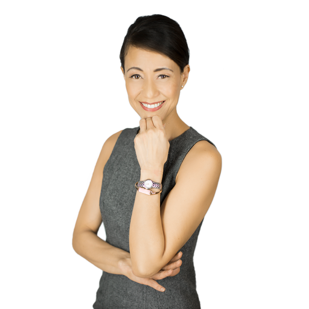 Paola Yawney headshot, standing against white background with hair tied back.
