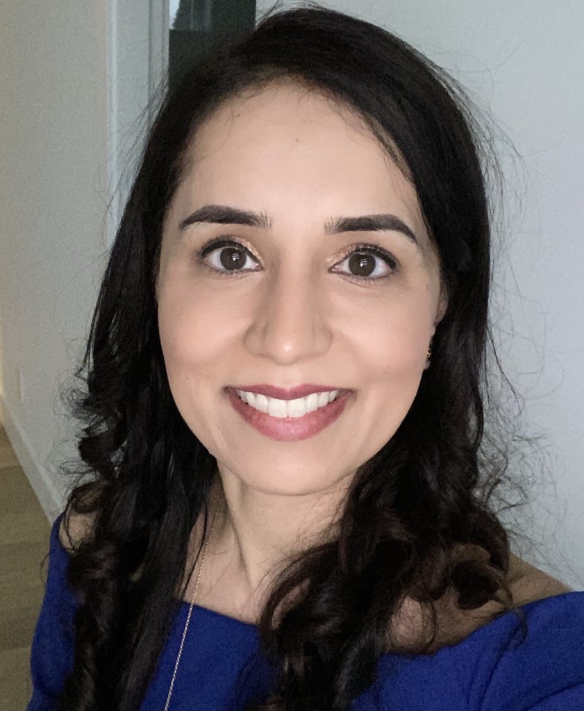 Kam Bains selfie, wearing dark blue top